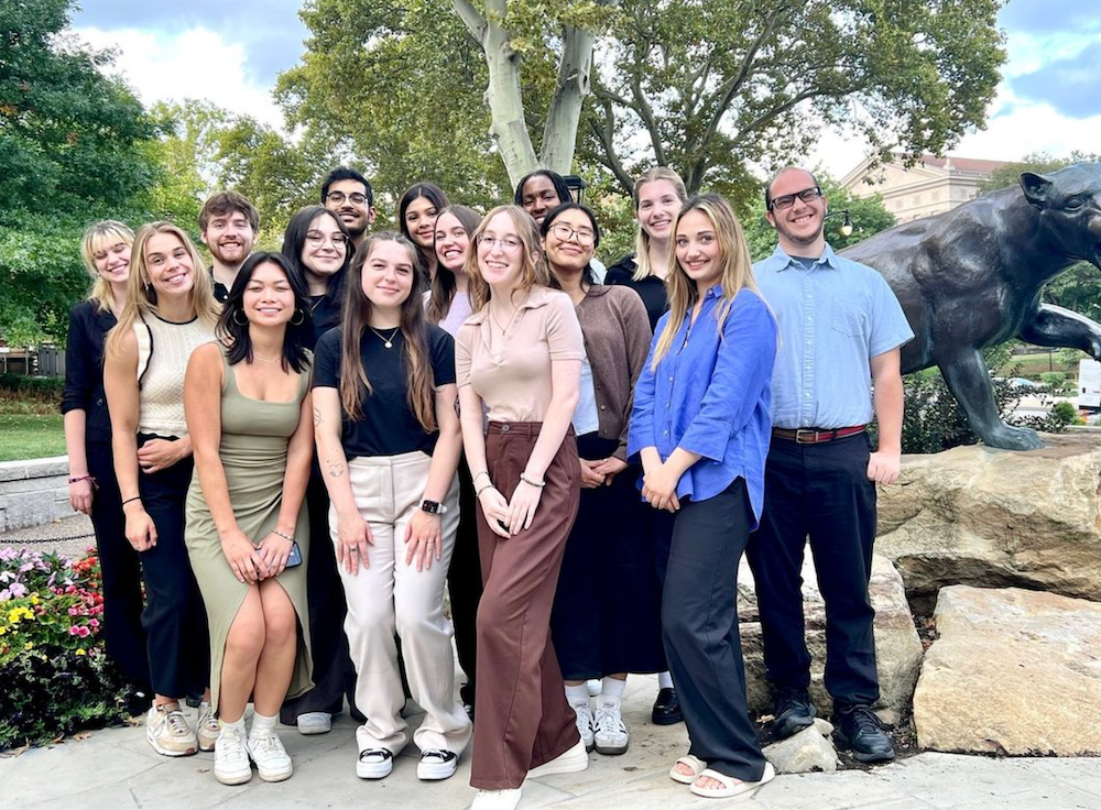 "This year's Policy and Social Impact Fellows pose with the Pitt Panther statue"