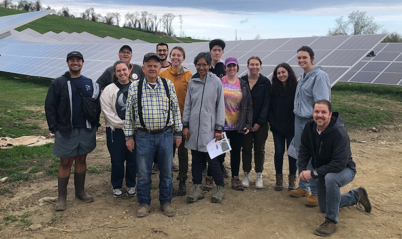 "Professors and students pose at Perk Solar Farm"