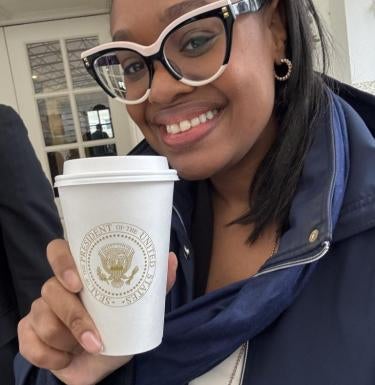 Danae Williams holds her coffee in the West Wing